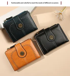 Detailed view of vintage faux leather wallets with sunflower buckles and zipper closure