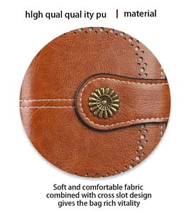 Detail of brown PU leather wallet featuring a sunflower metal snap and laser-cut holes