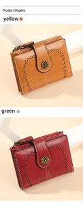 Detail view of retro oil wax leather wallets with metal sunflower buckle and zip pocket