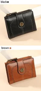 Detail view of retro oil wax leather wallets with daisy clasp and contrast stitching