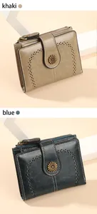 Detail view of khaki and blue vintage oil wax leather wallets with floral metal buckles