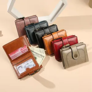 Retro oil wax leather short wallets for women with heart cutout and metal flower clasp