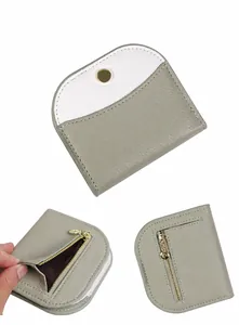 Detailed views of gray-green and white two-tone wallet with pebble leather and gold zipper
