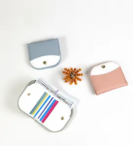 Detail of color-block folding wallet interior with 5 card slots and bill compartment