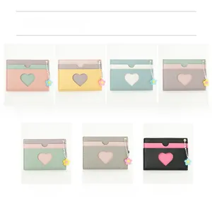 Grid display of multi-color PU leather card holders with heart cutout and floral charms