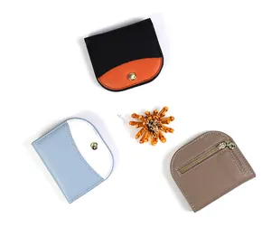 Detailed view of lychee texture leather wallets in minimalist semi-circle zipper design