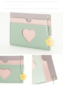 Detail view of multi-color PU leather card holder with heart window and flower pendant