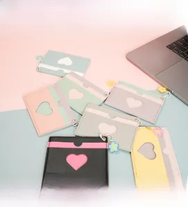 Close-up of colorful PU leather card holders with heart cutout and flower charms