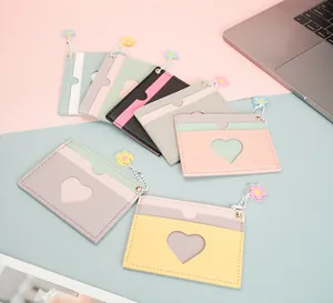 Detail of colorful PU leather card holders with heart window and flower pendant