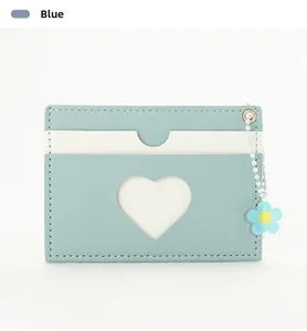 Close-up of light blue PU leather card holder with heart window and flower charm