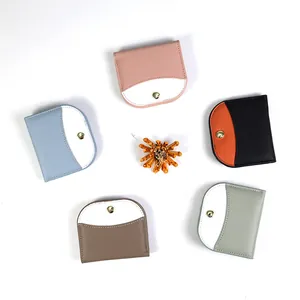 Slim semi-circular patchwork wallets in multiple colors with lychee texture leather