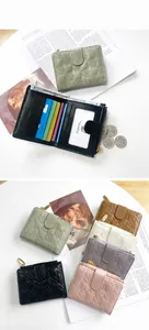 Detail view of colorful star quilted bifold wallets with multiple card slots and zip pocket