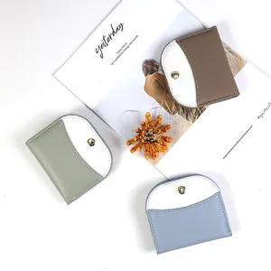Slim tri-color leather card wallets with semicircle stitching and snap closure