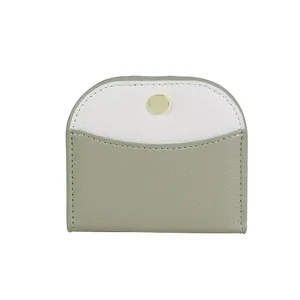 Slim tri-color leather bifold wallet with pebble texture and gold snap button closure
