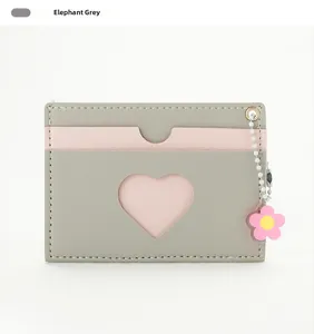 Detail of elephant grey PU leather card holder with heart window and flower charm