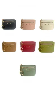 Detailed view of luxury multi-color small wallets with rivets and keychain rings