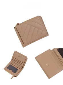 Detail view of quilted leather wallet with card slots and golden metal zipper hardware