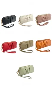 Detailed color selection of pleated leather clutch bags with secure gold zippers