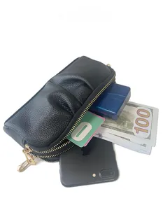 Capacity display of black pleated leather clutch bag with dual golden zippers