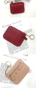Detail view of lychee texture wallet with card slots, zipper pocket and gold metal rivets