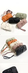 Detailed view of ruched clutch wallets in five colors with detachable wrist straps