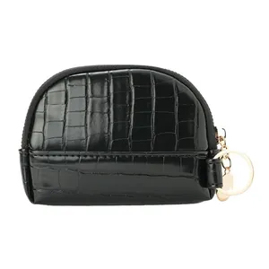 Black shell coin purse with crocodile pattern, golden keychain, and top zipper closure