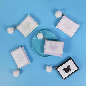 Variety of cute rabbit trifold wallets in pastel colors with white fluffy keychain charms