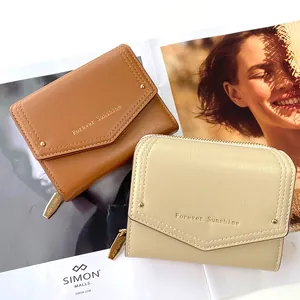 Women's minimalist short envelope wallets in tan and apricot with gold lettering