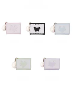 Detailed view of trifold wallets in five colors featuring cute rabbit designs and pom-poms