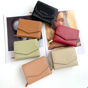 Short envelope wallet for women in multiple colors with gold lettering on white background