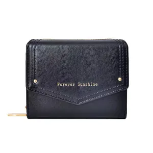 Minimalist black leather short wallet for women featuring golden rivets and envelope flap