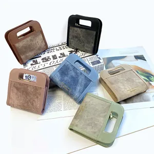 Carteras bandolera chic de textura denim con cremallera de metal y asas de corte