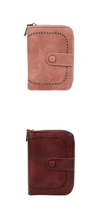 Dettaglio di portafogli vintage in pelle PU rosa e bordeaux con accenti tagliati al laser