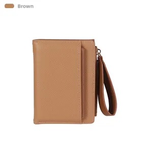 Close-up of brown crosshatch leather wallet featuring a zipper and wrist strap
