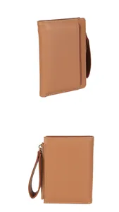 Detail view of caramel brown litchi grain leather wallet with wristlet and zipper