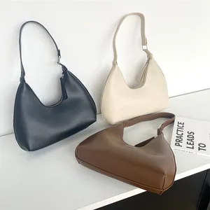 Minimalist PU leather hobo bag in black cream and brown colors with adjustable strap