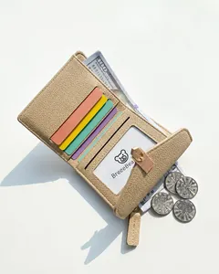 Detailed view showing multiple card slots and capacity of the beige tri-fold wallet