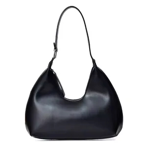 Minimalist black leather hobo crescent bag with adjustable strap on white background