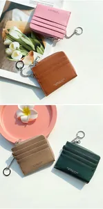 Detail of lychee textured leather card holders with keychains in four stylish colors
