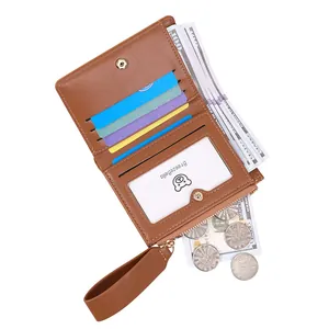 Brown short vegan leather wallet for women with multi-card slots and a wrist strap