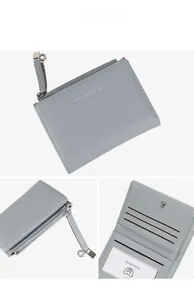 Detail view of grey litchi leather wallet showing zipper pocket and internal card slots