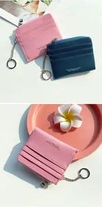 Detail of pink and blue pebble leather card holders with zip pocket and key chain