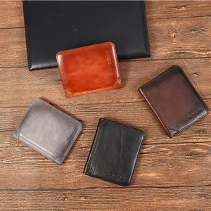 Genuine leather bi-fold wallets for men in four colors on a textured wood background