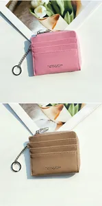 Detail of pink and khaki pebbled leather coin purses with card slots and keychains