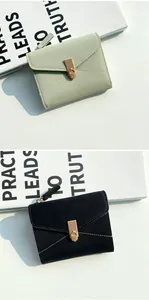 Detail of lychee pattern leather wallets with golden buckles in green and black colors