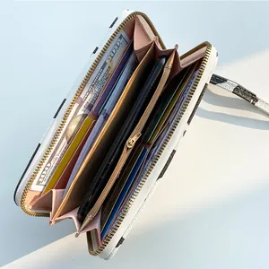 Large zebra print zip-around wallet with multiple card slots and phone pocket