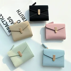 Collection of women's leather folding wallets with snap buttons and gold metal buckles
