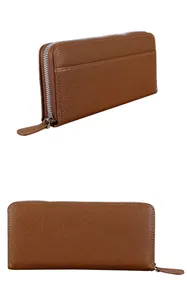 Detail view of brown lychee leather long wallet with silver zipper and side pocket