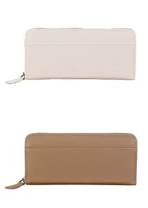Detail of white and brown long wallets in textured lychee leather with zippers