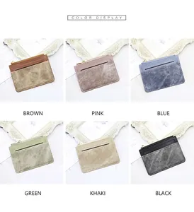 Slim leather card holder available in various colors with a gold metal zipper detail